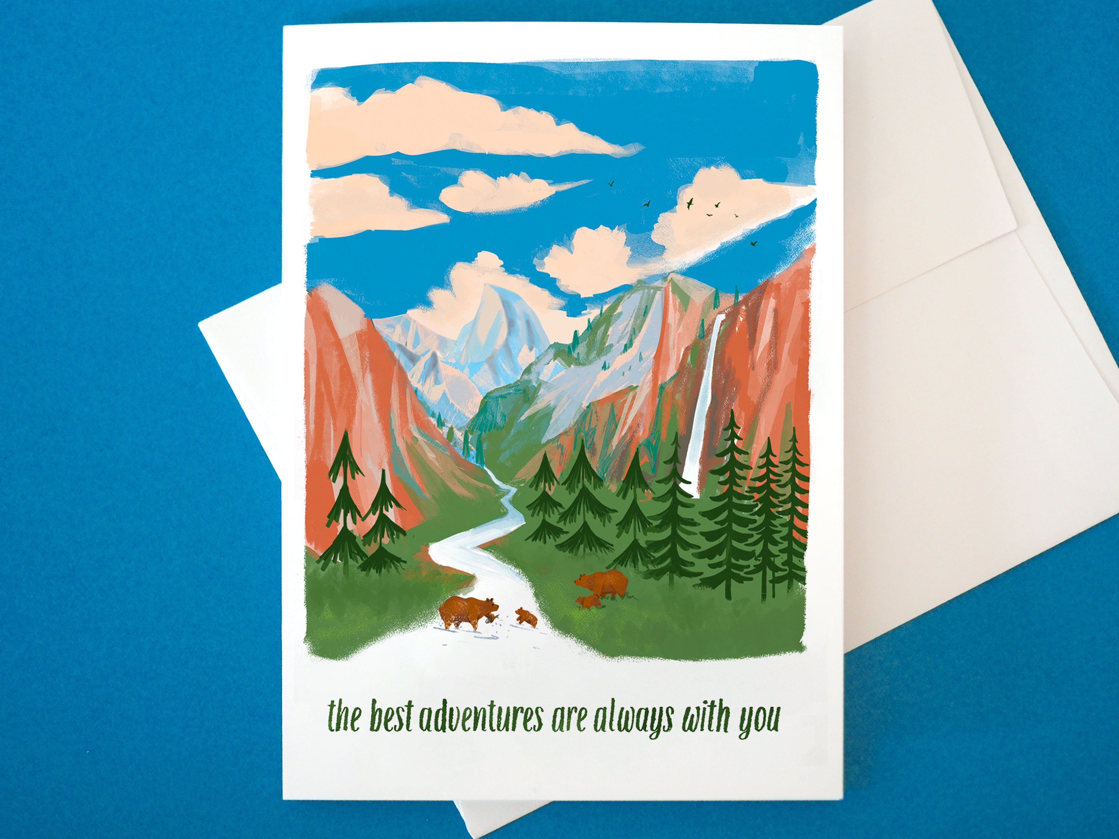 Greeting card with Yosemite half dome mountain and bear illustration and 'the best adventures are always with you' text on a blue background.